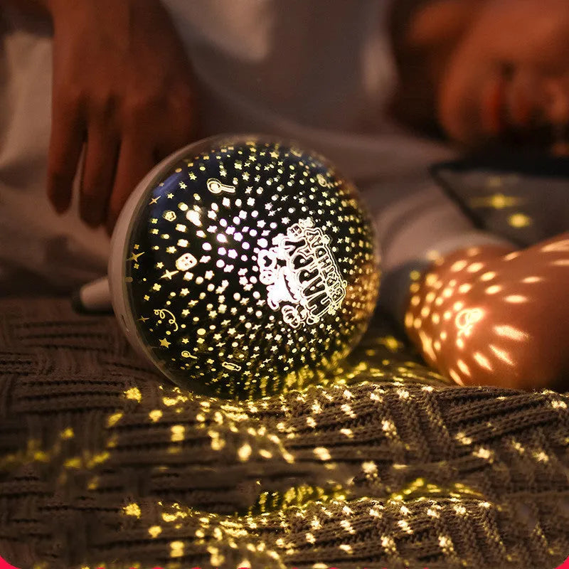 Black rotating starlight projection lamp projecting cartoon stars onto a ceiling