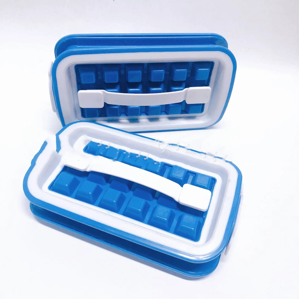 Blue silicone ice cube tray with 36 square cavities and a lid on a wooden table