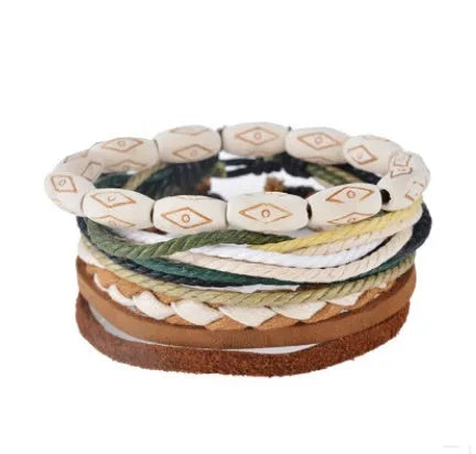 Handmade adjustable leather wrap bracelet with wooden beads on a wrist.