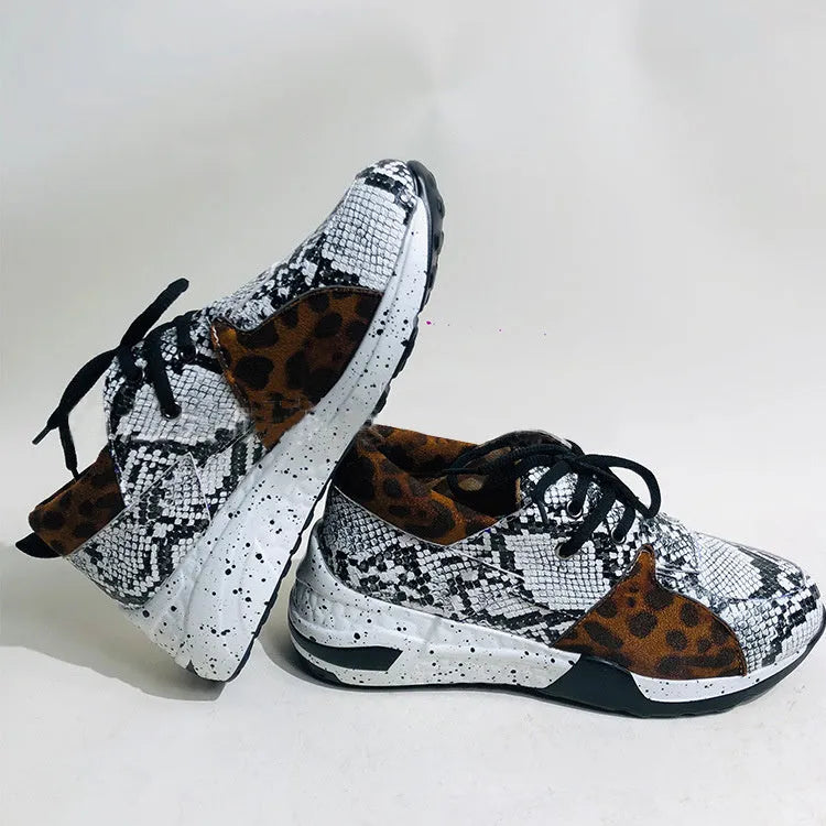 Women's casual suede sneakers with a wedge heel in black, leopard, pink, and snake pattern colours.