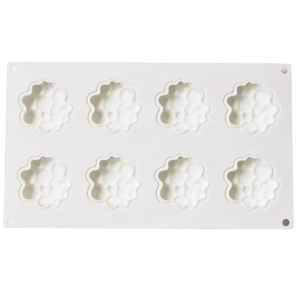 Round silicone cake mould with 8 raised bubble towers for tiered desserts.