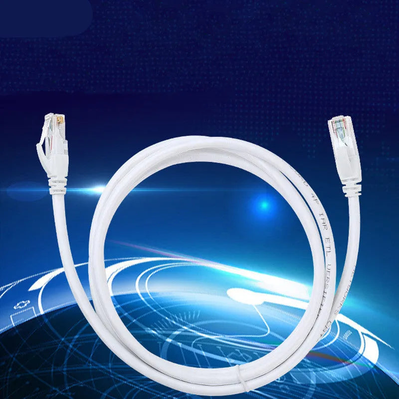 White Cat6 network cable with RJ-45 connectors on both ends lying on a flat surface