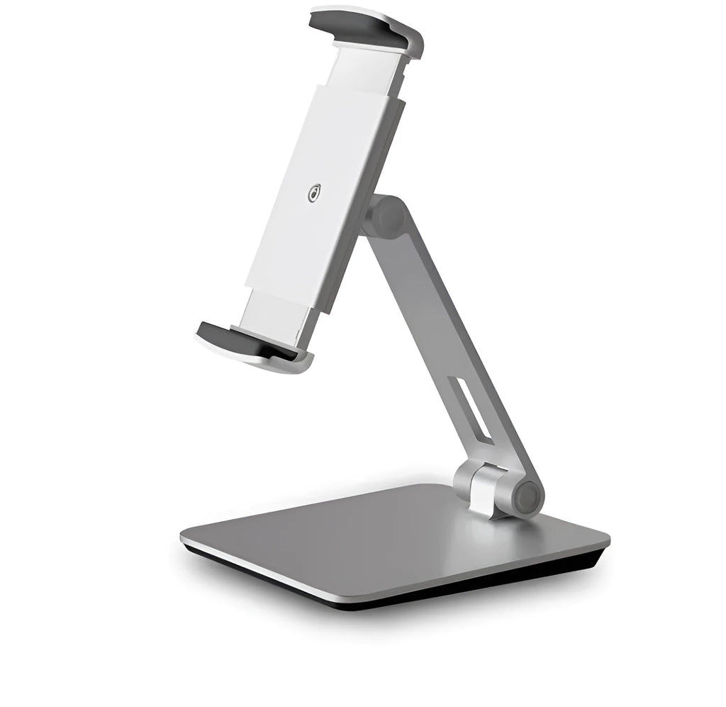 Silver foldable aluminium phone and tablet stand on a desk, holding a tablet at an angle.