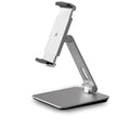 Silver foldable aluminium phone and tablet stand on a desk, holding a tablet at an angle.