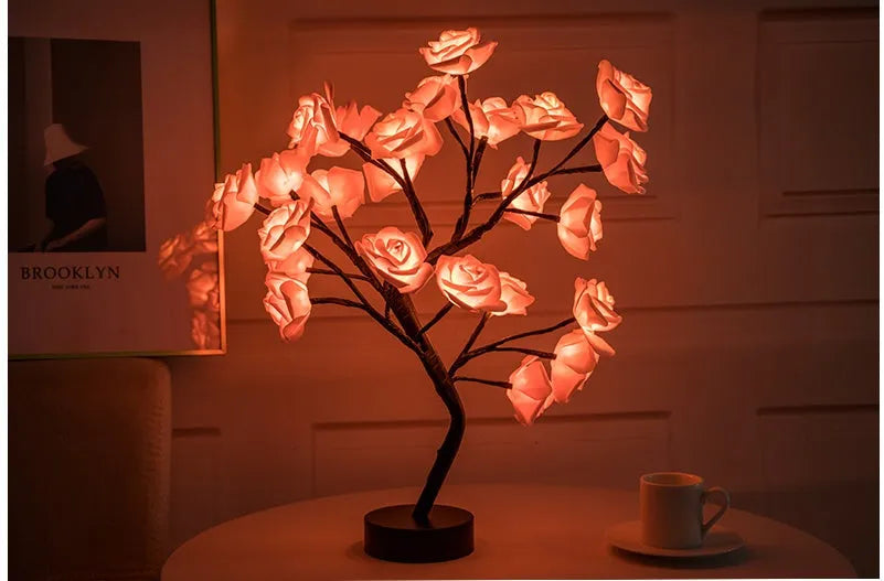 White and red rose flower LED table lamp with bonsai tree lights on a table.