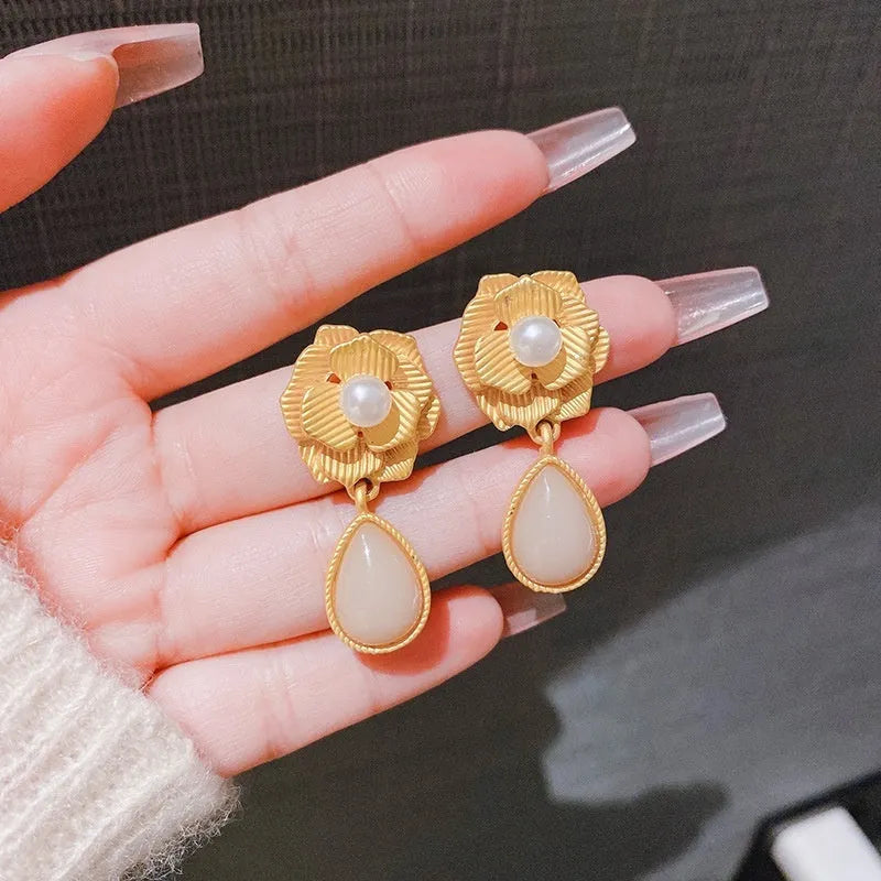 Gold-colour Hong Kong style floral stud earrings with opal stone and ice flower design on rose pearl motif.