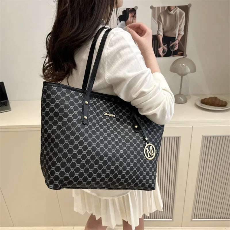 Women's structured PU leather shoulder bag in street-trend style with sewing thread detail.