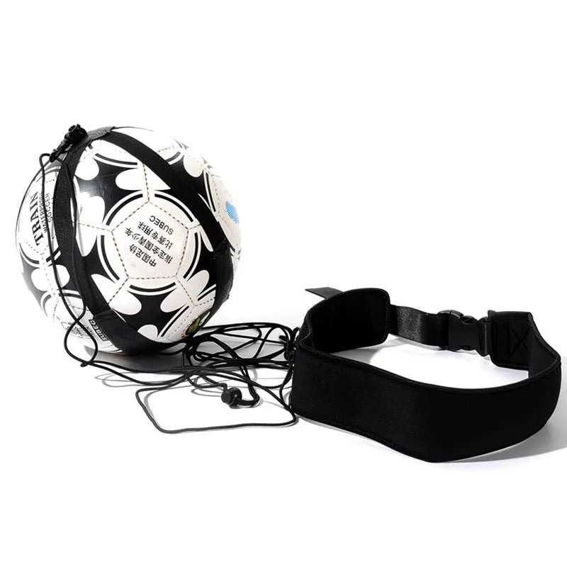 Black soccer training tether with adjustable waist belt and elastic Velcro strap on a green grass field
