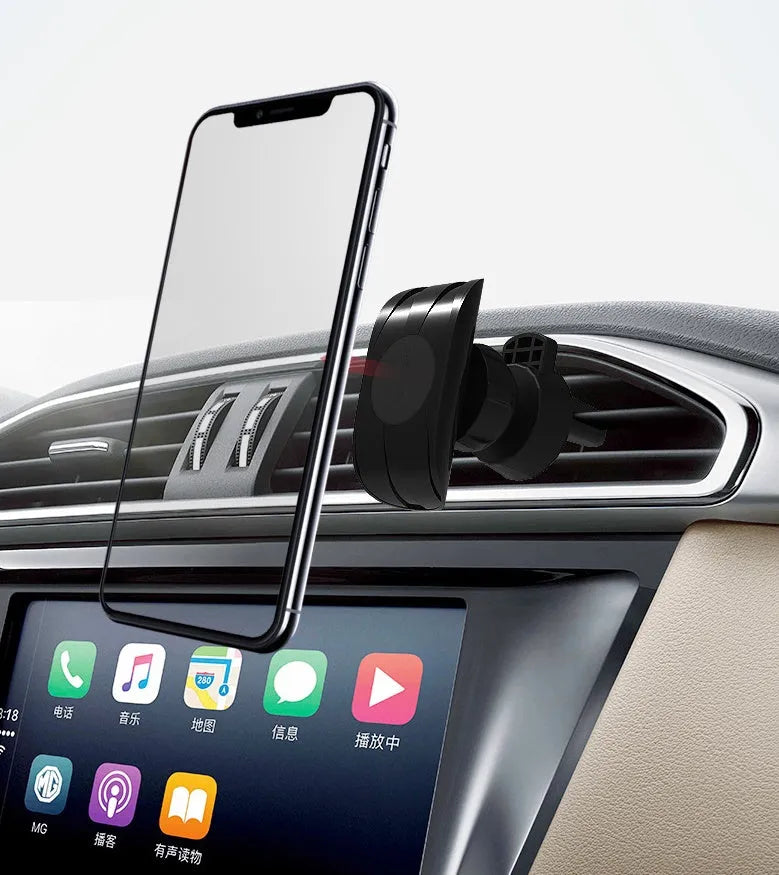 Black car phone holder mounted on vehicle air vent with phone in cradle