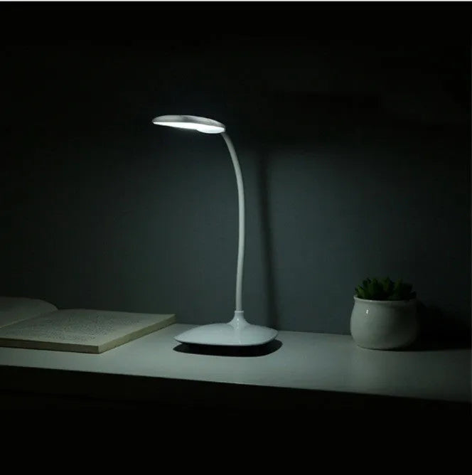 White LED desk lamp with touch control and USB charging, compact simple design on desk