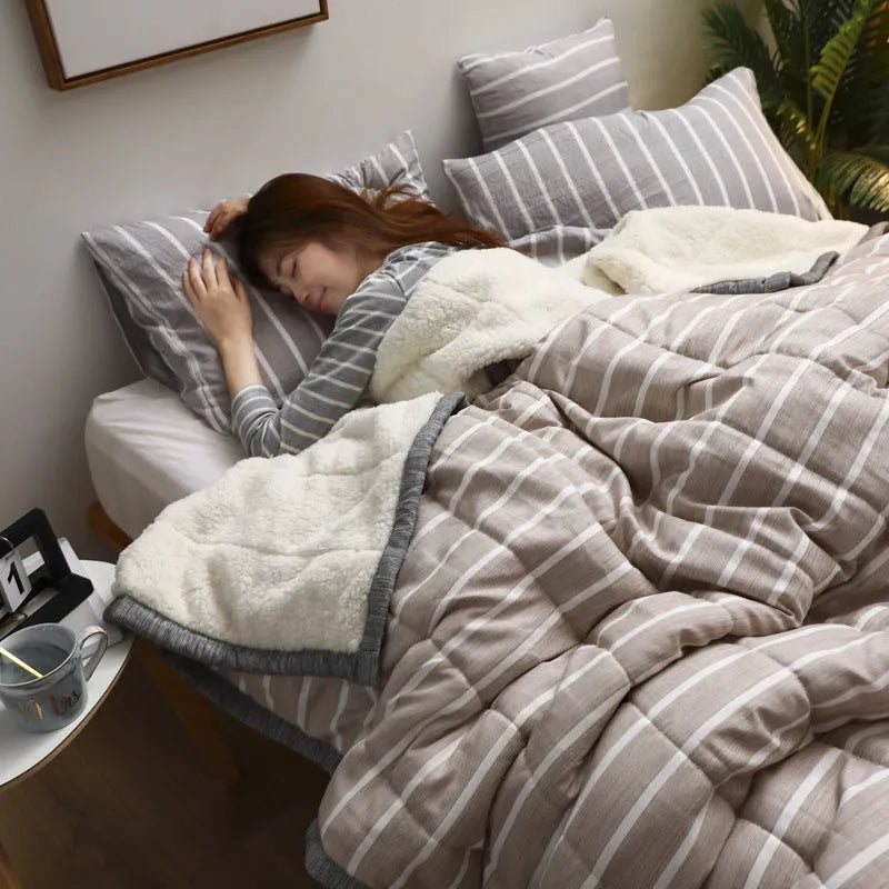 Avocado green coral fleece blanket folded to show its thick texture and 150x200cm size.