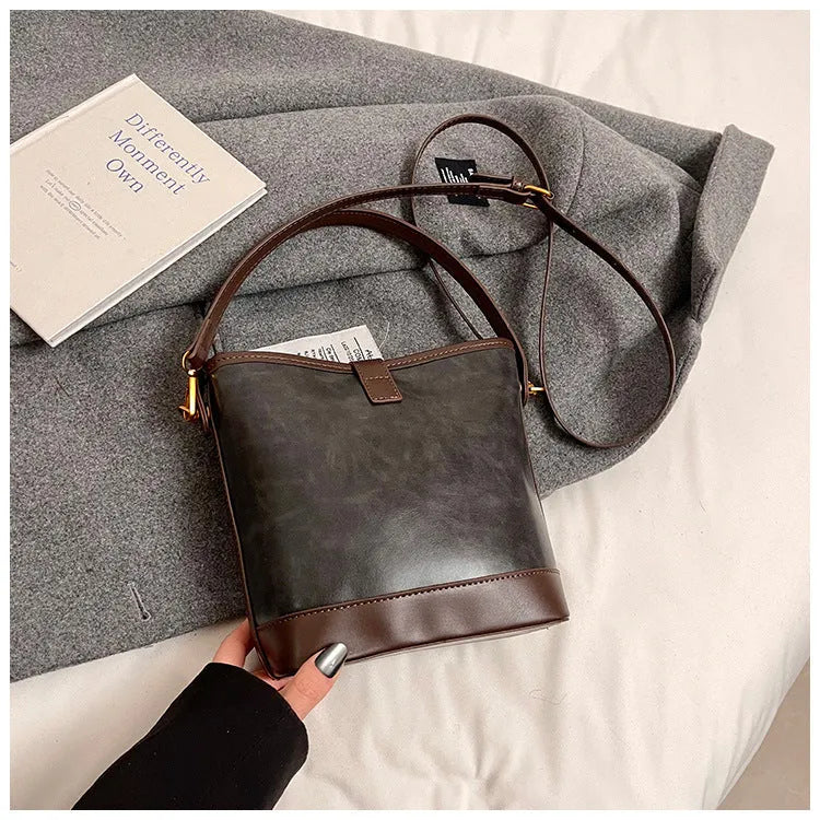 Women's PU handbag in simple style available in black, brown, and coffee colours in large and small sizes