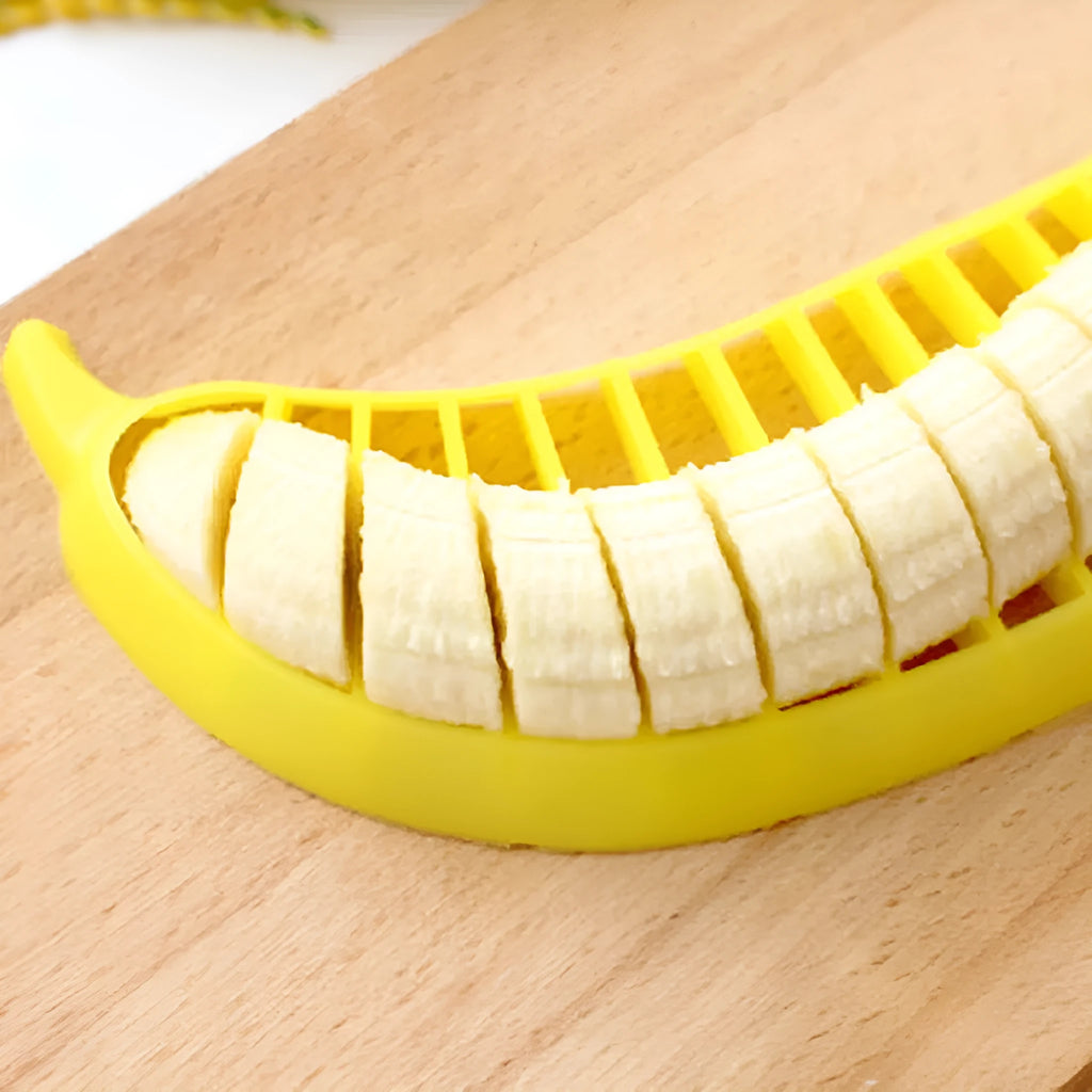 Yellow food grade PP banana slicer measuring approx 25 x 7 x 1.4 cm