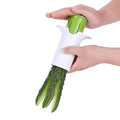 White vegetable cutter with six stainless steel blades for slicing cucumbers, carrots and strawberries