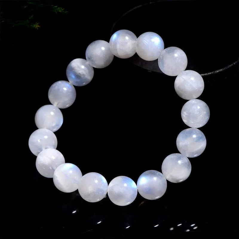 Natural blue moonlight coloured moonstone round bead bracelet on a white background.