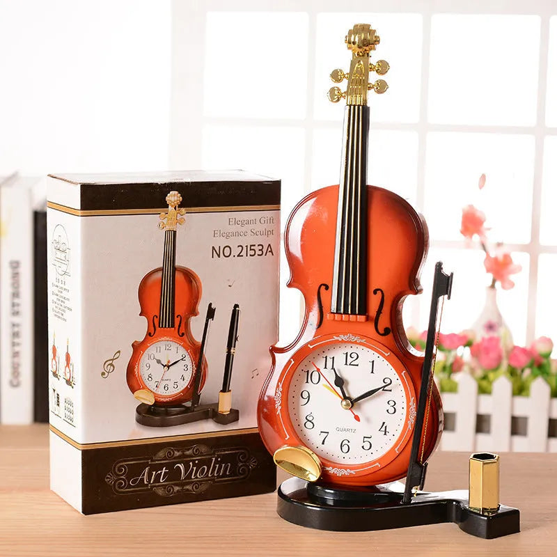 Brown plastic violin pen inserted alarm clock with quartz movement and LED display on a desk