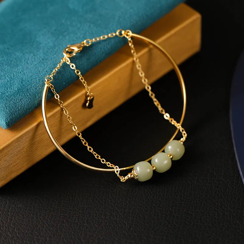 Women's jade lucky beads bracelet with gold inlay treatment in single, double, and three bead styles.