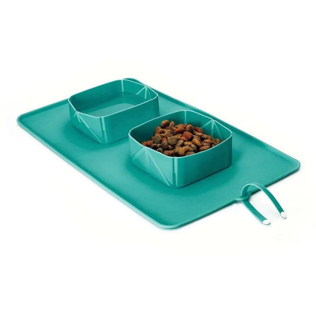 Silicone folding pet bowl in black, collapsed flat showing non-slip base