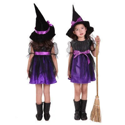 Child wearing a linen witch costume for fancy dress, available in bat, broom, purple and yellow designs.