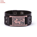 Teen Wolf leather cuff bracelet with metal buckle on a brown background