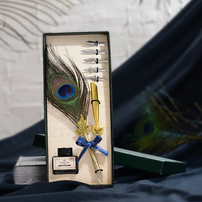 Retro green peacock feather pen set with ink bottle, base, and replacement nibs in box