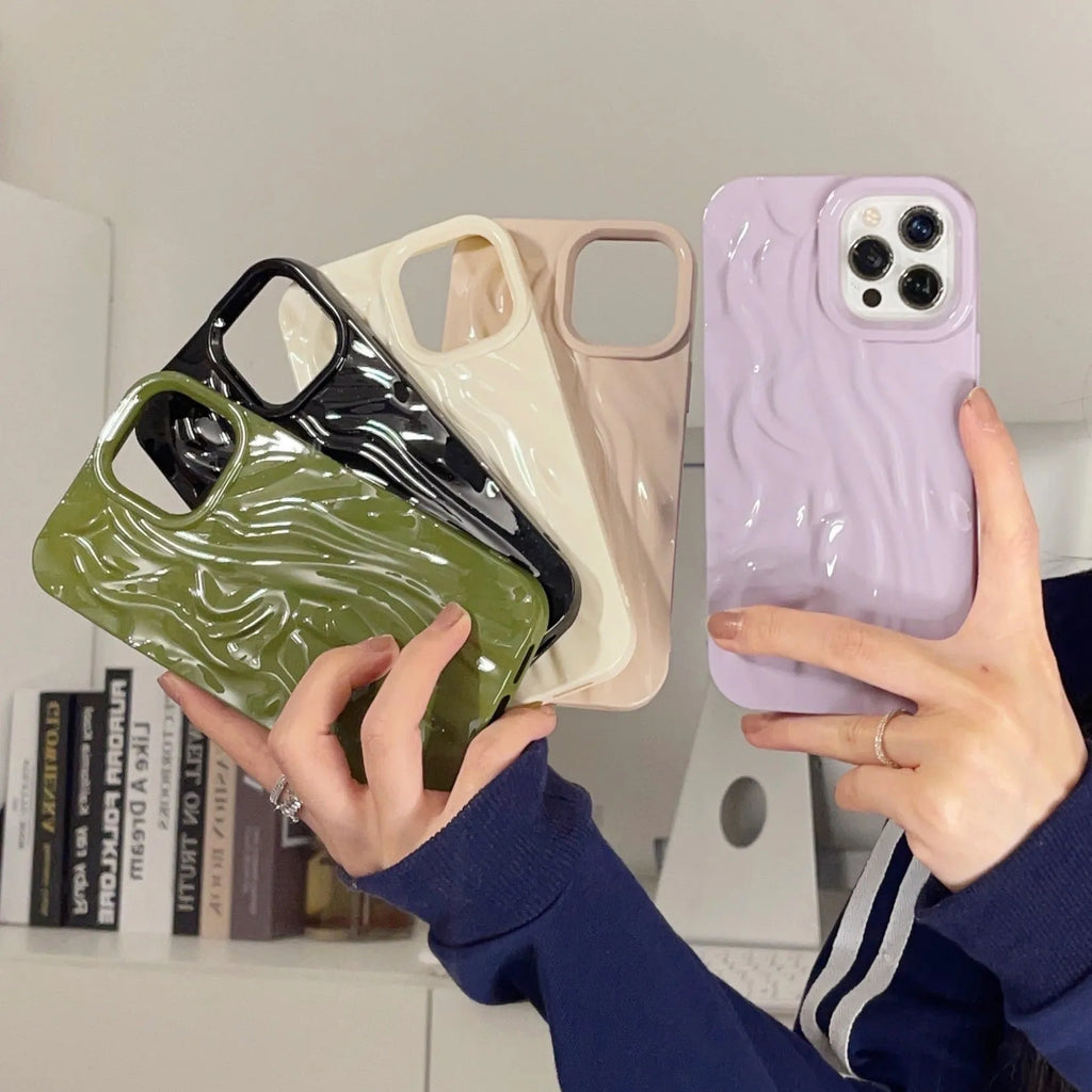 Ins style solid colour water ripple silicone phone case for iPhone models on a plain background.