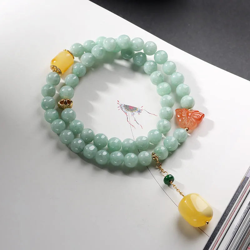 Close-up of a double-layer women's bracelet with jade round beads and beeswax barrel beads in a retro geometric design