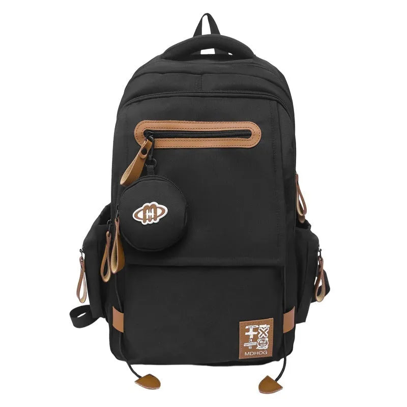 Large black waterproof nylon travel backpack with contrast stitching, shown with a 20-35L capacity.