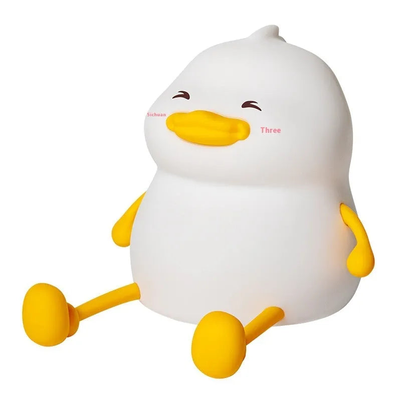 Chubby Night Light on a desk showing its compact size and silicone phone holder feature.