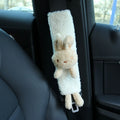 Cartoon lamb wool seat belt shoulder protector in Rabbit design placed on a car seat belt
