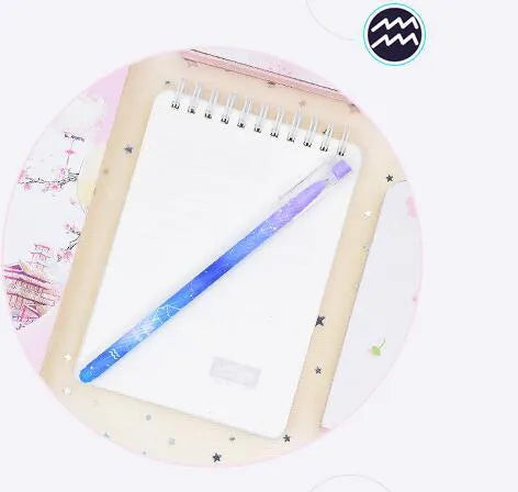 Box of 12 plastic gel pens with quick-drying ink and constellation-themed designs in assorted colours