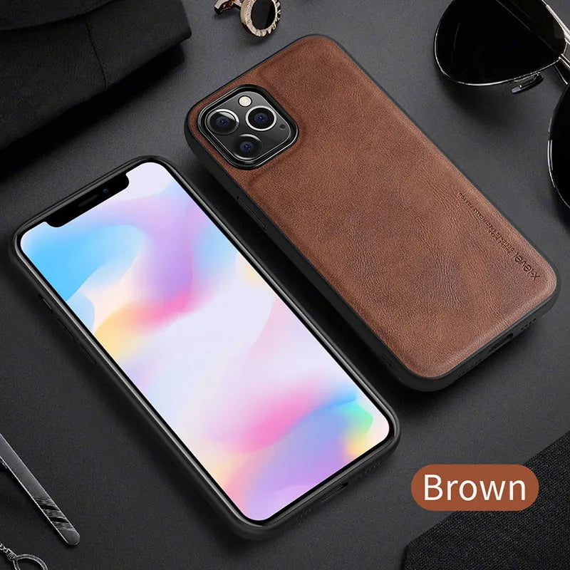 Black PU leather iPhone 12 phone case with soft TPU sides on a wooden table.
