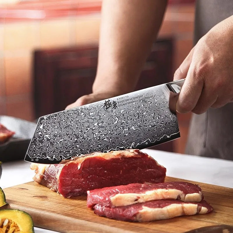 12-piece Damascus steel kitchen knife set with various blade types on a wooden block.