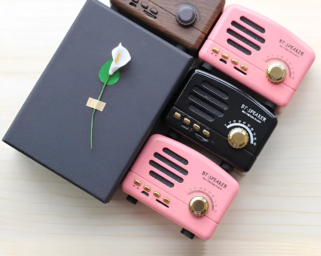 Compact vintage-style Bluetooth speaker in wood grain finish showing front grille and compact dimensions.