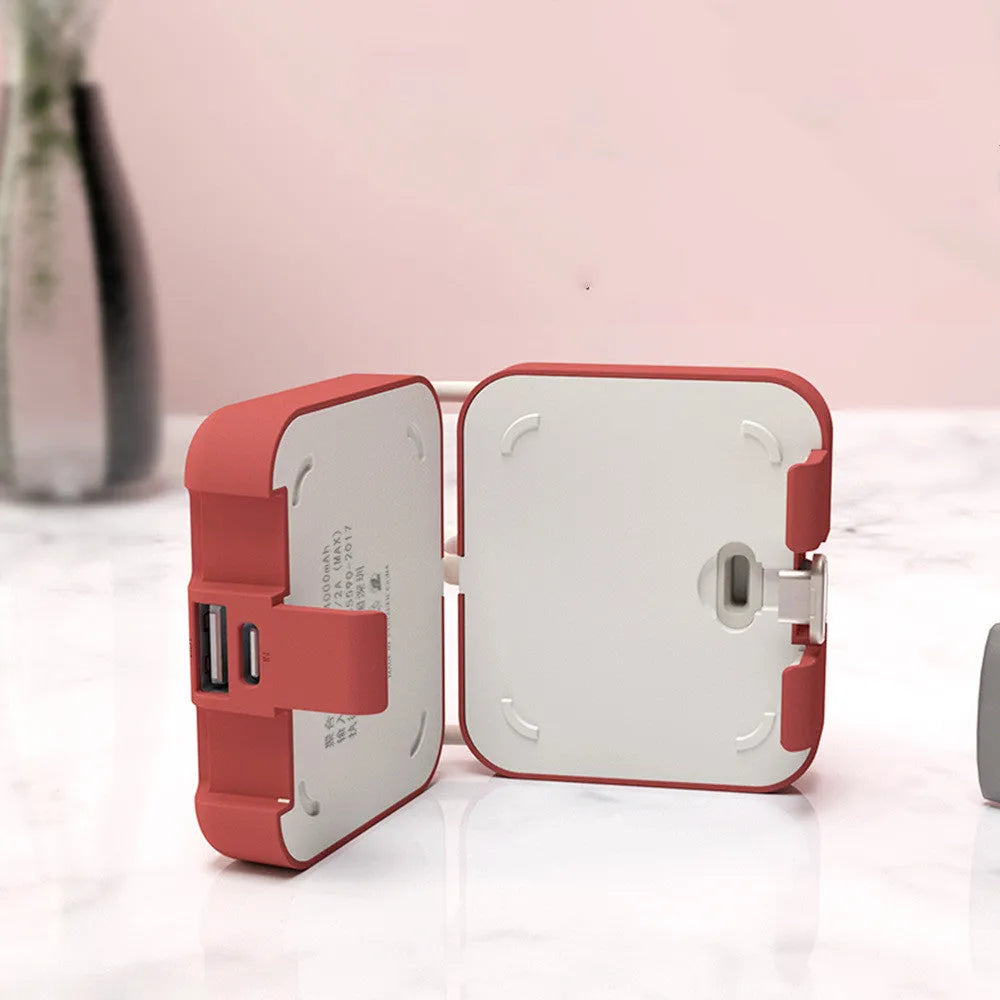 Handbag clip power bank in blue, green, red, or white showing phone stand function and charging ports