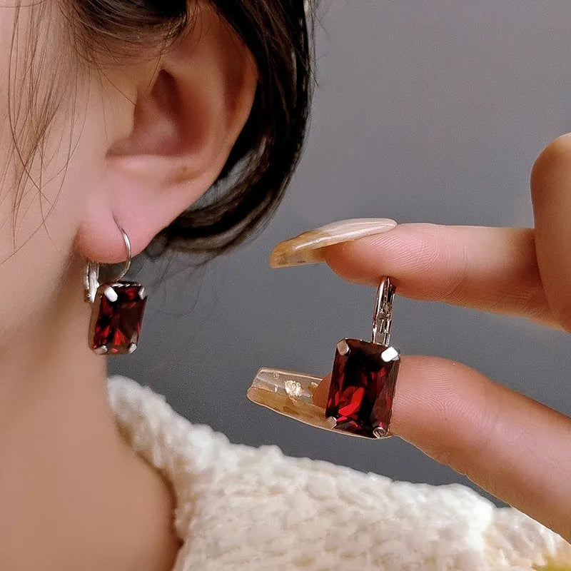 Square copper fashion earrings with crystals in purple, red and yellow colours