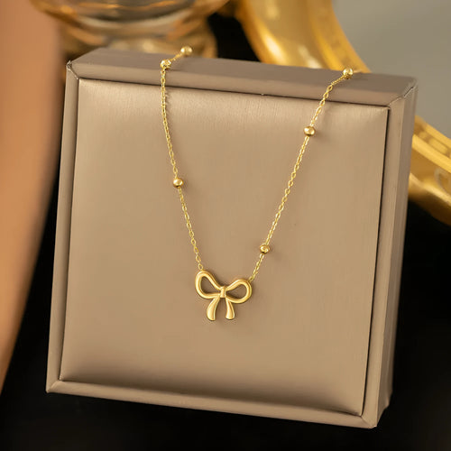 Gold bow necklace with adjustable chain on titanium steel with electroplated finish