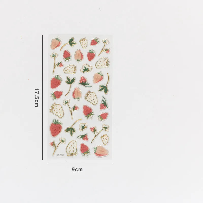 Sheet of six DIY fruit bronzing stickers showing grape, orange, passion fruit, peach, pineapple and strawberry designs.