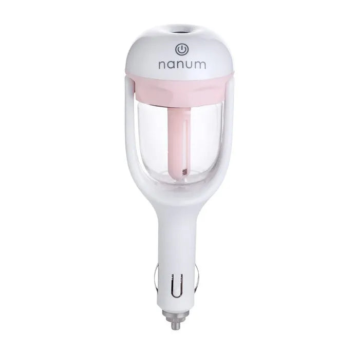 Compact blue portable car humidifier and essential oil diffuser with rotating nozzle on a car dashboard.