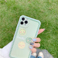 Green TPU iPhone back cover case with geometric smiley face and polka dot frame pattern.