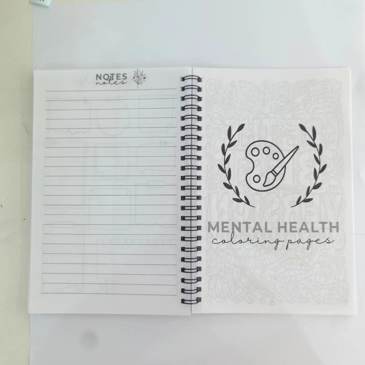 Pink brain mental health planning notepad with coil binding and 80g paper pages