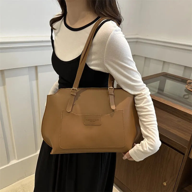 Women's structured PU tote bag in a horizontal square shape with double shoulder straps, shown in a neutral colour.