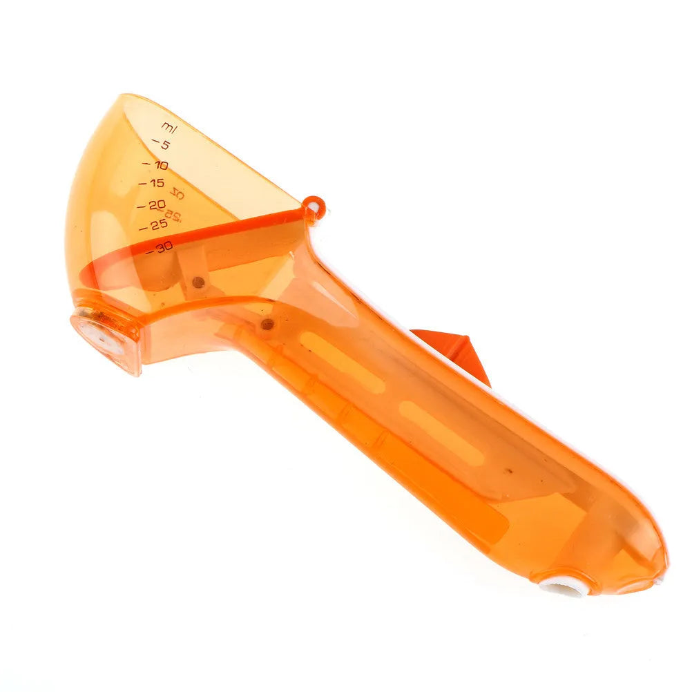 Two magnetically nested digital measuring spoons in blue and orange on a kitchen surface