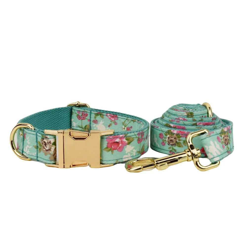Rose print dog collar set with green background including collar, leash, detachable bow, and vest