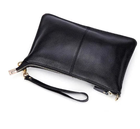 Lady's cowhide leather slant bag in apricot colour with hand strap and shoulder strap showing zipper compartments