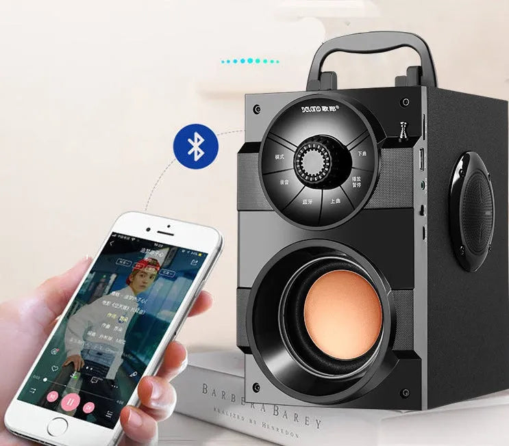 Black portable mini home audio system with subwoofer and 3.5mm audio connection cable