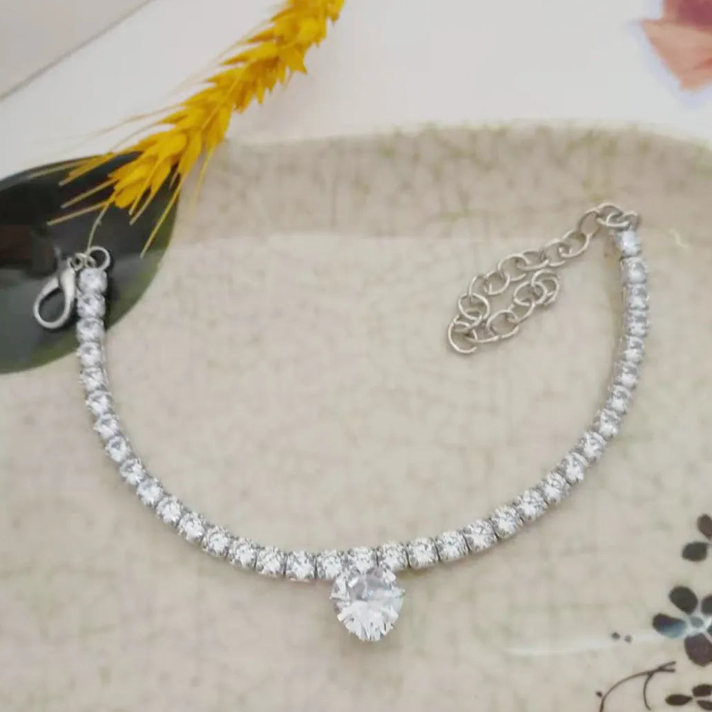 Heart-shaped rhinestone pet collar in metallic gold with extension chain for dogs and cats