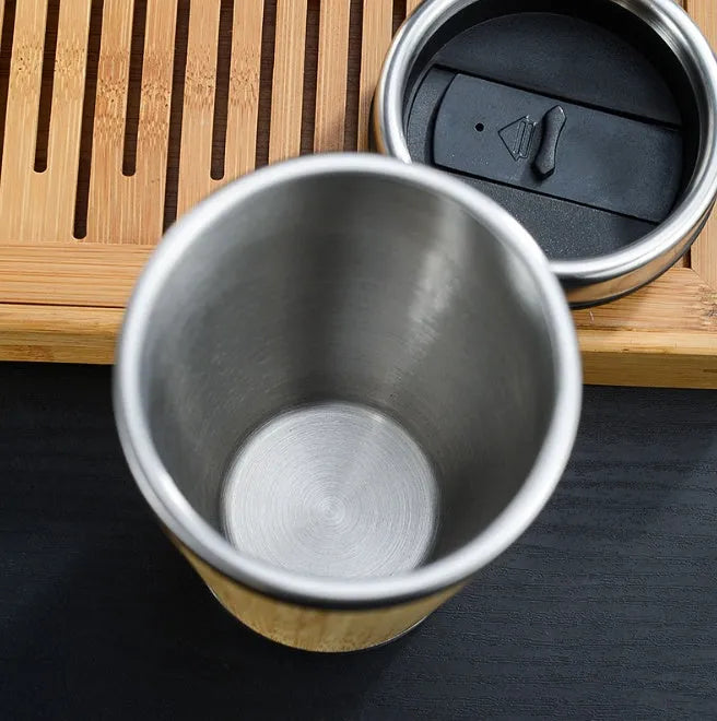 Bamboo coffee cup with thermal insulation, leak-proof lid, and anti-slip foam pad base showing 420ml capacity
