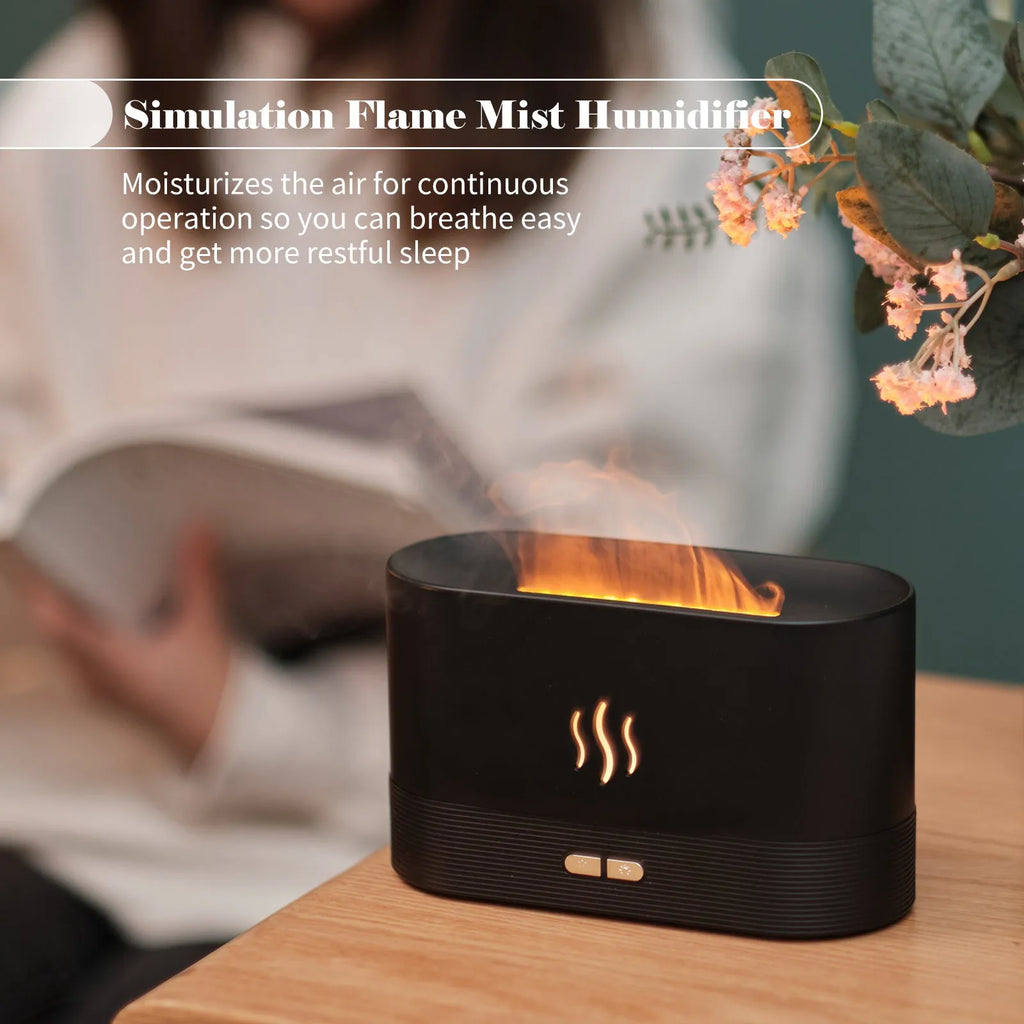 Ultrasonic aroma diffuser with flame light, black, 75x75x137mm, on wooden table with mist