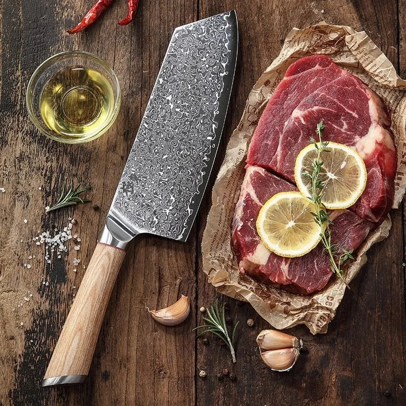 12-piece Damascus steel kitchen knife set with various blade types on a wooden block.